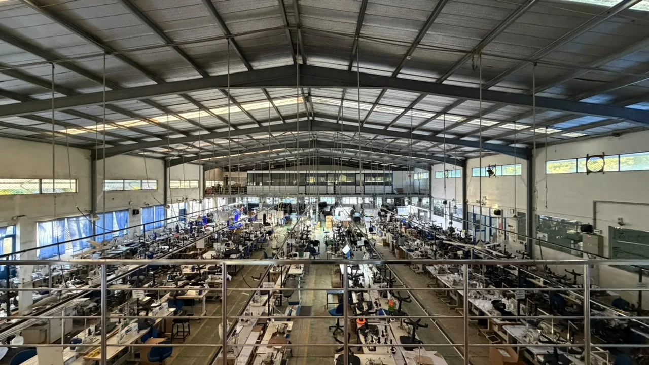 The Dewmini Apparel sewing floor seen from the mezzanine