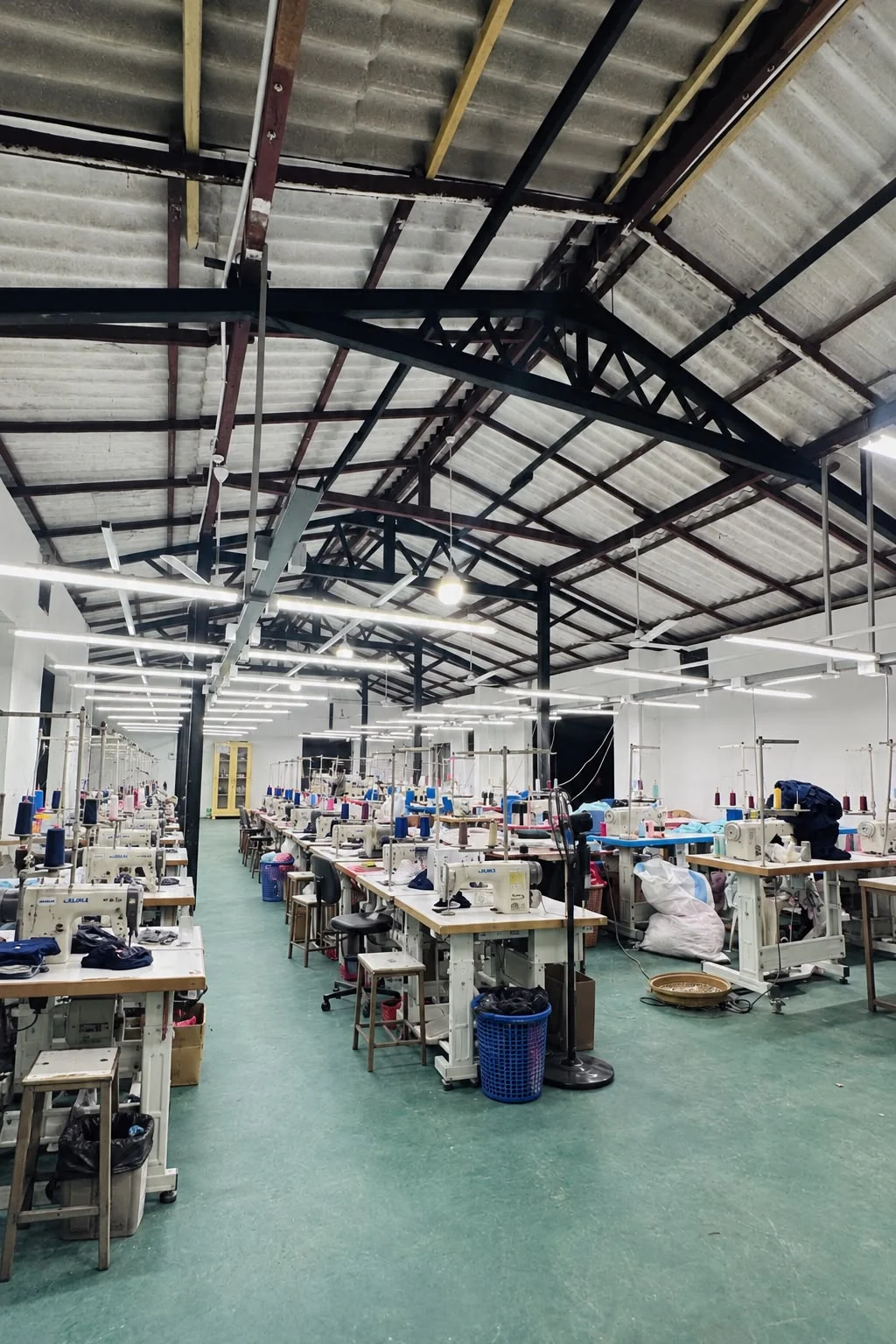 Rows of sewing machines on the Divyana Apparel floor
